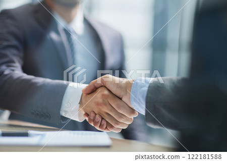 Businessman handshake for teamwork of business merger and acquisition 122181588