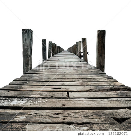 An old wooden pier extends into the water 122182071