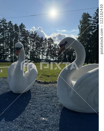 Swan Sculptures in a Serene Park Landscape Swan Sculptures in a Serene Park Landscape 122182430