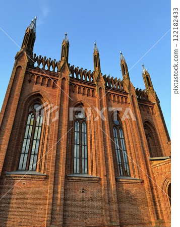 Close-Up of Neo-Gothic Church Wall with Sunlit Details Close-Up of Neo-Gothic Church Wall with Sunlit Details 122182433