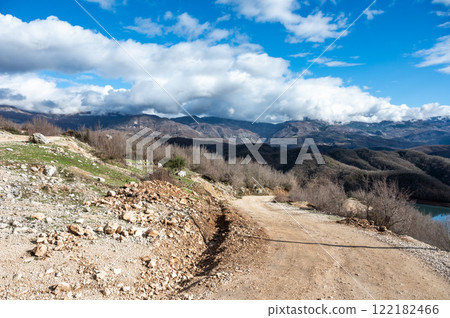 Swirling gravel road at the Gamti mountain near Bovilla lake, Albania Swirling gravel road at the Gamti mountain near Bovilla lake, Albania 122182466