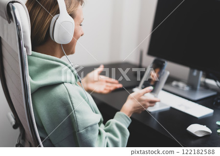 woman chatting by video call woman chatting by video call 122182588