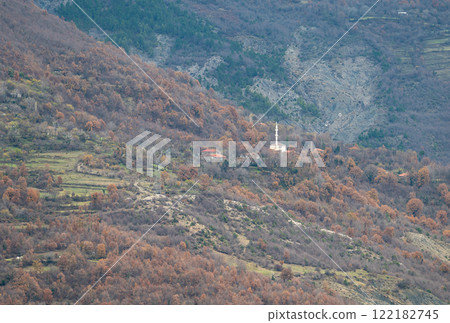 Minaret of a white mosque Xhamia Mner i Siperm in the Gamti mountains, Albania Minaret of a white mosque Xhamia Mner i Siperm in the Gamti mountains, Albania 122182745