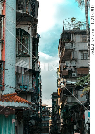 Urban Alleyway Featuring a Variety of Unique Architectural Structures and Elements Urban Alleyway Featuring a Variety of Unique Architectural Structures and Elements 122182915