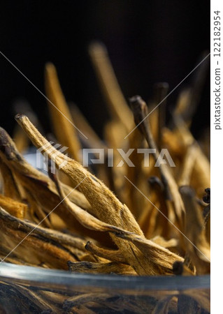 Stylish and Elegant Dried Botanical Stems Are Displayed Beautifully Within a Glass Bowl 122182954