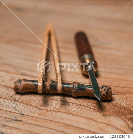 Beautiful, handcrafted woodworking tools displayed elegantly on a rustic wooden surface 122183046