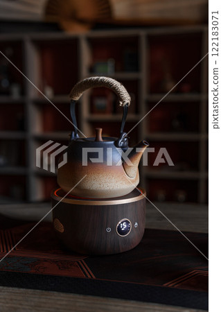 Discover the Elegant Teapot resting on a Wooden Base for Truly Serene and Delightful Tea Moments Discover the Elegant Teapot resting on a Wooden Base for Truly Serene and Delightful Tea Moments 122183071