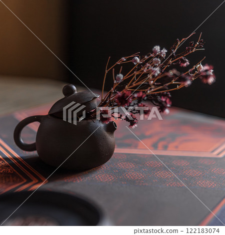 An Elegant Teapot Adorned with Beautiful Dried Flowers Set on a Sophisticated Background An Elegant Teapot Adorned with Beautiful Dried Flowers Set on a Sophisticated Background 122183074