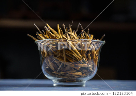 Natural Dried Sticks Elegantly Arranged in a Stylish Glass Bowl for Beautiful Rustic Home Decor 122183104