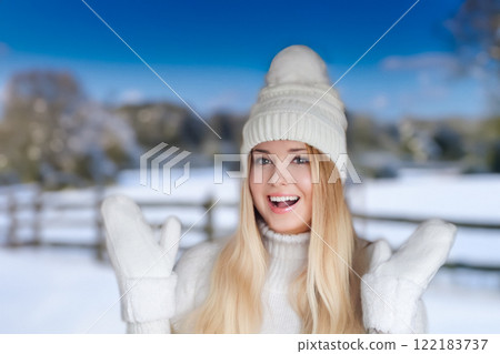 Blonde woman wearing warm mittens, knitted beanie hat and jumper, winter snow nature background with copyspace fashion and lifestyle idea Blonde woman wearing warm mittens, knitted beanie hat and jumper, winter snow nature background with copyspace fashion and lifestyle idea 122183737