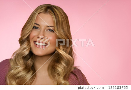 Woman, pink background, beauty and glamour. Blonde beautiful woman, soft curls and glowing skin, fashion and elegance idea 122183765
