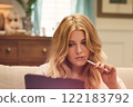 Woman, pen and laptop, thoughtful planning and creative brainstorming. Blonde beautiful woman, remote work and online productivity on sofa, casual elegance and focus on project goals idea 122183792