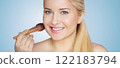 Woman, makeup and beauty, applying blush with a brush. Blonde beautiful woman, glowing skin and skincare routine, elegance and confidence idea 122183794