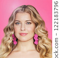 Woman, beauty and elegance, blonde with glamour curls and pink earrings. Beautiful feminine model, confidence, charm and sophistication, portrait with soft makeup and radiant smile portrait 122183796