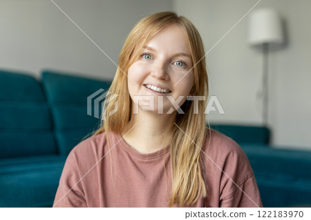 Close up face of woman with beautiful smile standing at home. 30s female rest and spend free spare time in living room indoors. People lounge concept 122183970