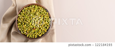 Protein-rich mung beans in a wooden bowl top view Protein-rich mung beans in a wooden bowl top view 122184193