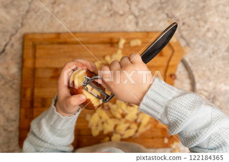 Child Peeling Potato Child Peeling Potato 122184365