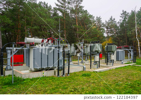 Electrical equipment in outdoor power substation, two three phase oil immersed transformers 122184397