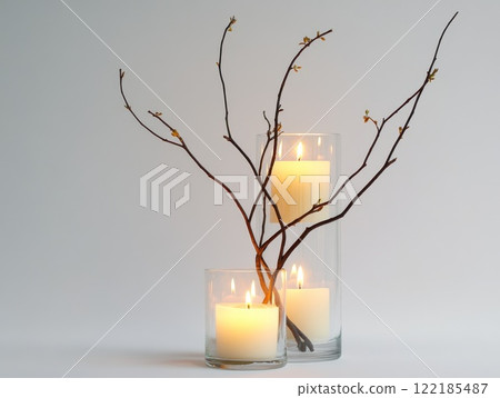 A childs hand holding a glitter-filled transparent Christmas ornament, blurred holiday lights in the background, festive scene 122185487
