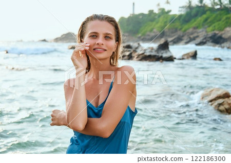 Stunning woman in wet dress on exotic beach. Smooth skin, fresh after ocean swim. Perfect for beauty, skincare, fragrance ads. High-end cosmetics, luxurious island vibe. Elegant atmosphere, nature. Stunning woman in wet dress on exotic beach. Smooth skin, fresh after ocean swim. Perfect for beauty, skincare, fragrance ads. High-end cosmetics, luxurious island vibe. Elegant atmosphere, nature. 122186300