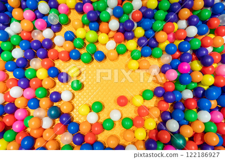 A cheerful and colorful ball pit perfect for kids' fun and playtime. A cheerful and colorful ball pit perfect for kids' fun and playtime. 122186927