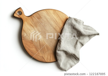 Empty wooden cutting board and kitchen towel on white background, top view 122187895