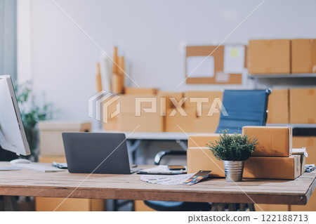 Portrait of Starting small businesses SME owners female entrepreneurs working on receipt box and check online orders to prepare to pack the boxes, sell to customers, SME business ideas online. 122188713