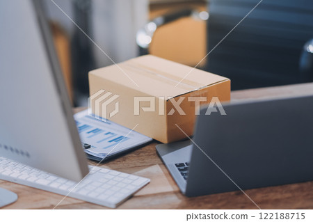 Portrait of Starting small businesses SME owners female entrepreneurs working on receipt box and check online orders to prepare to pack the boxes, sell to customers, SME business ideas online. Portrait of Starting small businesses SME owners female entrepreneurs working on receipt box and check online orders to prepare to pack the boxes, sell to customers, SME business ideas online. 122188715