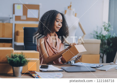 Portrait of Starting small businesses SME owners female entrepreneurs working on receipt box and check online orders to prepare to pack the boxes, sell to customers, SME business ideas online. 122188718