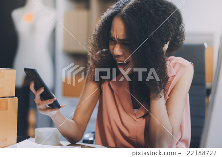 Portrait of Starting small businesses SME owners female entrepreneurs working on receipt box and check online orders to prepare to pack the boxes, sell to customers, SME business ideas online. 122188722