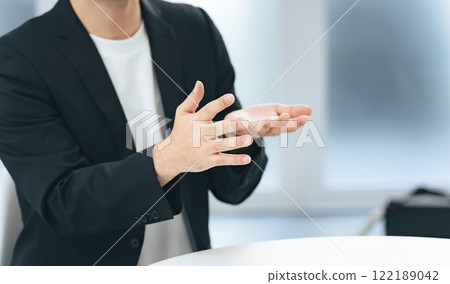 man explaining with gestures man explaining with gestures 122189042