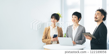 Group of business people laughing in the office Group of business people laughing in the office 122189056