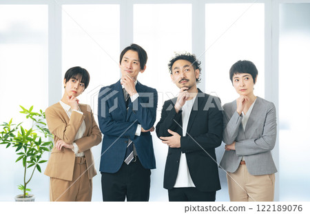 Group of business people standing side by side in an office 122189076