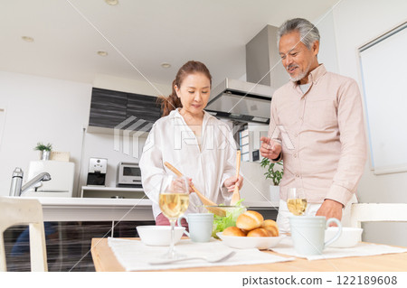 Senior couple cooking Senior couple cooking 122189608