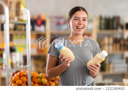 Woman chooses mayonnaise Woman chooses mayonnaise 122190481