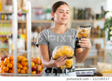 Woman choosing pasta and spaghetti 122190517