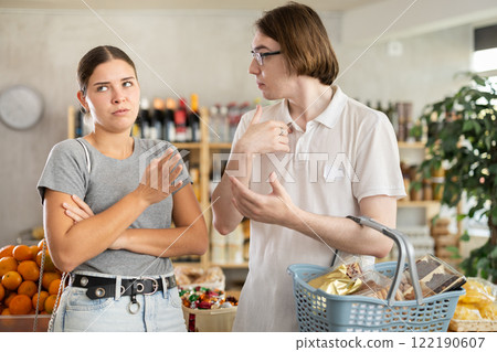Couple quarrel in a supermarket Couple quarrel in a supermarket 122190607