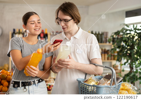 Woman and man scanning drinks 122190617