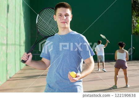 Portrait of caucasian man frontenis player in outdoor court 122190638