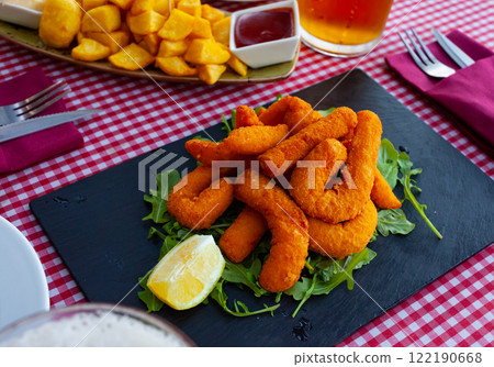 Sepia breaded and fried (chocos, typical tapa in Spain) Sepia breaded and fried (chocos, typical tapa in Spain) 122190668