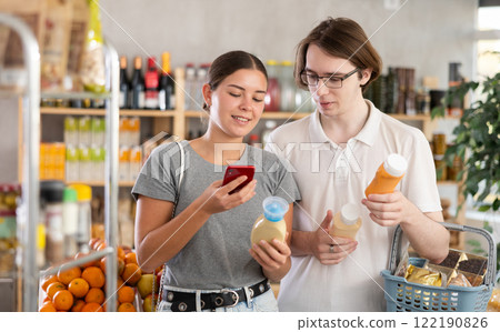 Couple man and woman scanning qr code for sauces 122190826