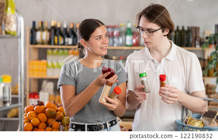 Couple man and woman scanning qr code for spices and seasonings 122190832