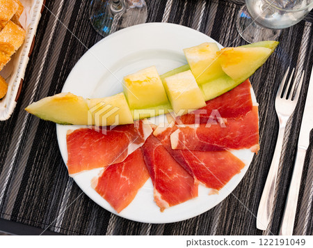 Melon with ham prosciutto jamon. Melon with ham prosciutto jamon. 122191049