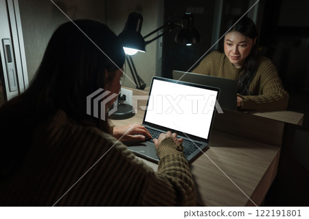 woman working with laptop at night (with clipping path) 122191801