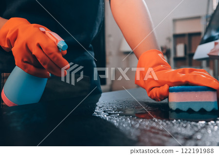 Janitor wiping table in office 122191988
