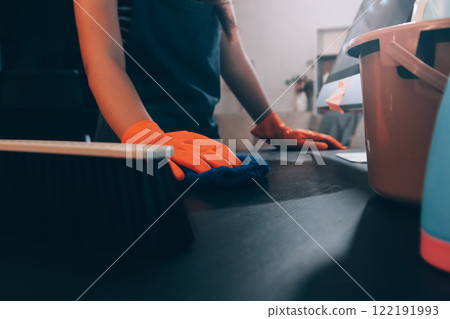 Janitor wiping table in office 122191993