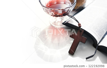 Bread, wine, a cross, and a Bible symbolizing the holy blood and body of Jesus Christ, the background of the Holy Communion 122192098