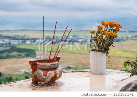 Incense sticks smoke on a Buddhist altar on pagoda in Vietnam in Asia Incense sticks smoke on a Buddhist altar on pagoda in Vietnam in Asia 122192171