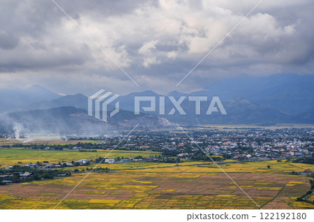 top view of rice fields with villages on background of mountains in Vietnam in Asia 122192180