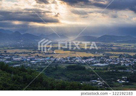 top view of rice fields with villages against background of mountains in Vietnam in Asia in the evening 122192183